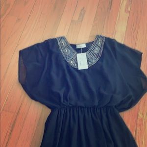 Flowy black chiffon like cocktail mini dress.